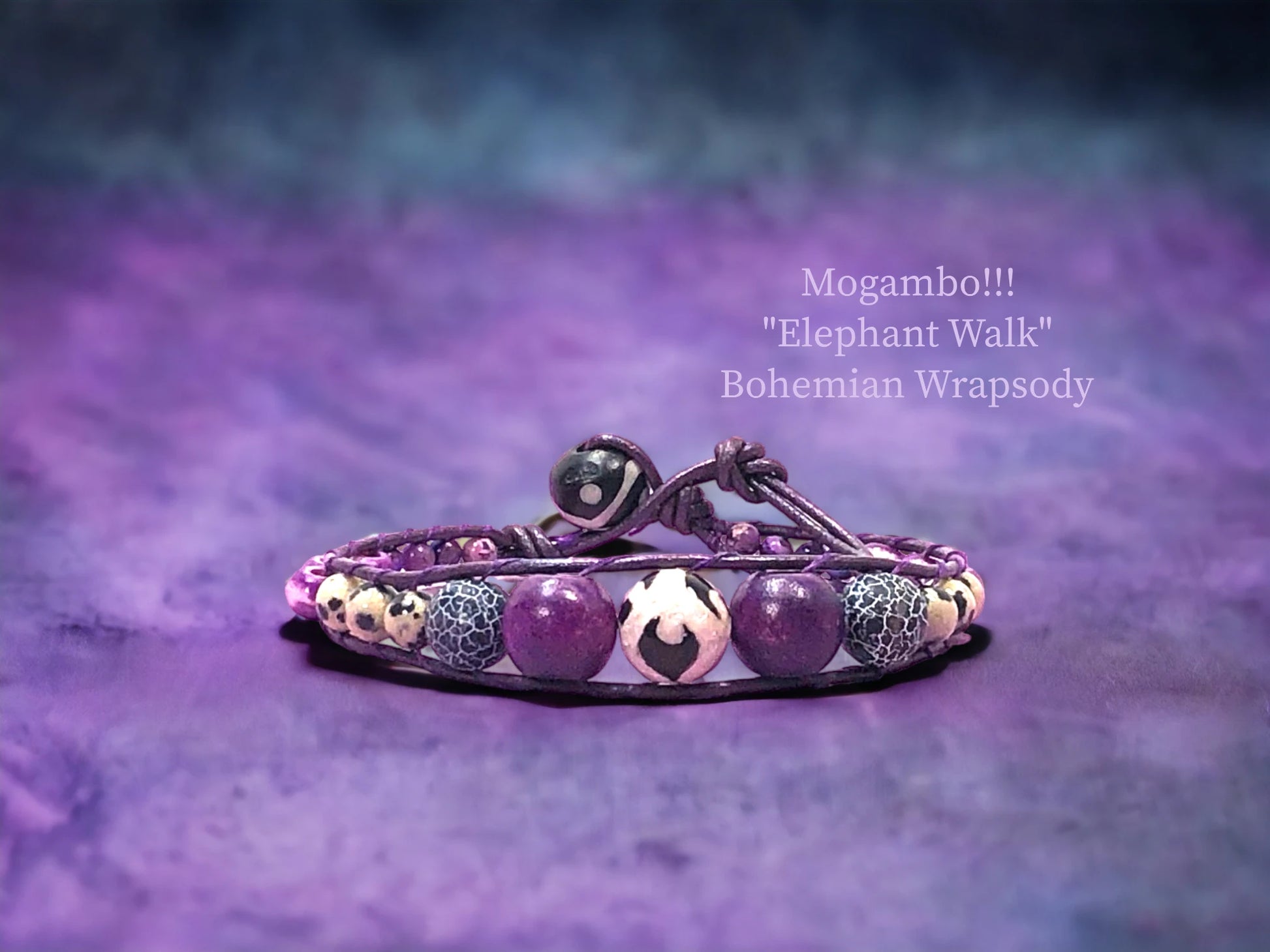 Bohemian Wrapsody- Dark purple genuine leather cording encasing a black Onyx printed Agate, Black Crackle Agate, purple Dyed and waxed wood Beads, Dalmation Jasper, and Purple Sea Sediment Jasper. $36.99