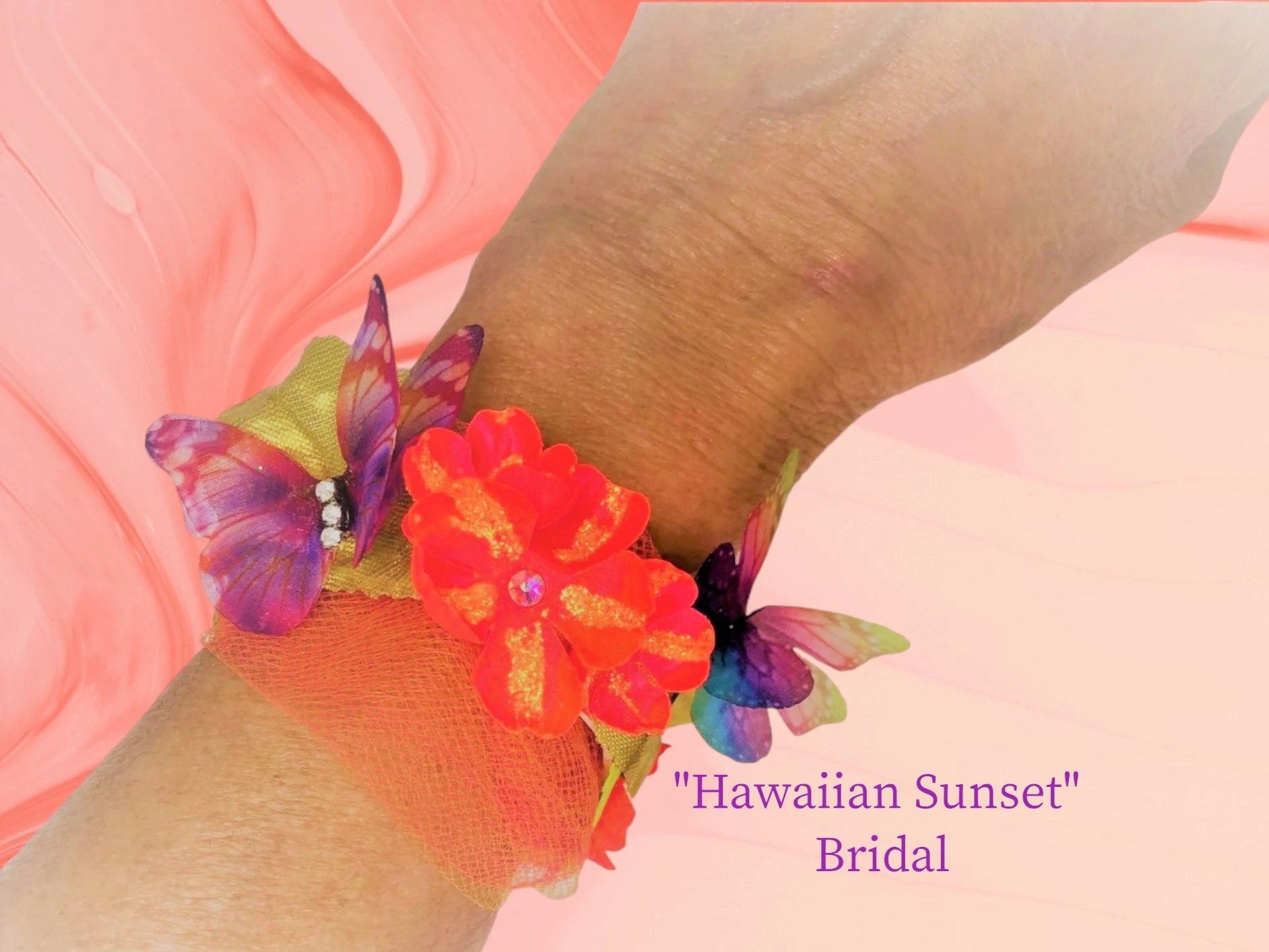 Hawaiian Sunset- These vibrant colors are for the bold at heart! Neon Orange and crystal center silk flowers w/ vibrant orange & purple chiffon butterflies, green leaves, bright coral tulle, and gold lame' leaves make up this beautiful wedding bracelet. $42.99