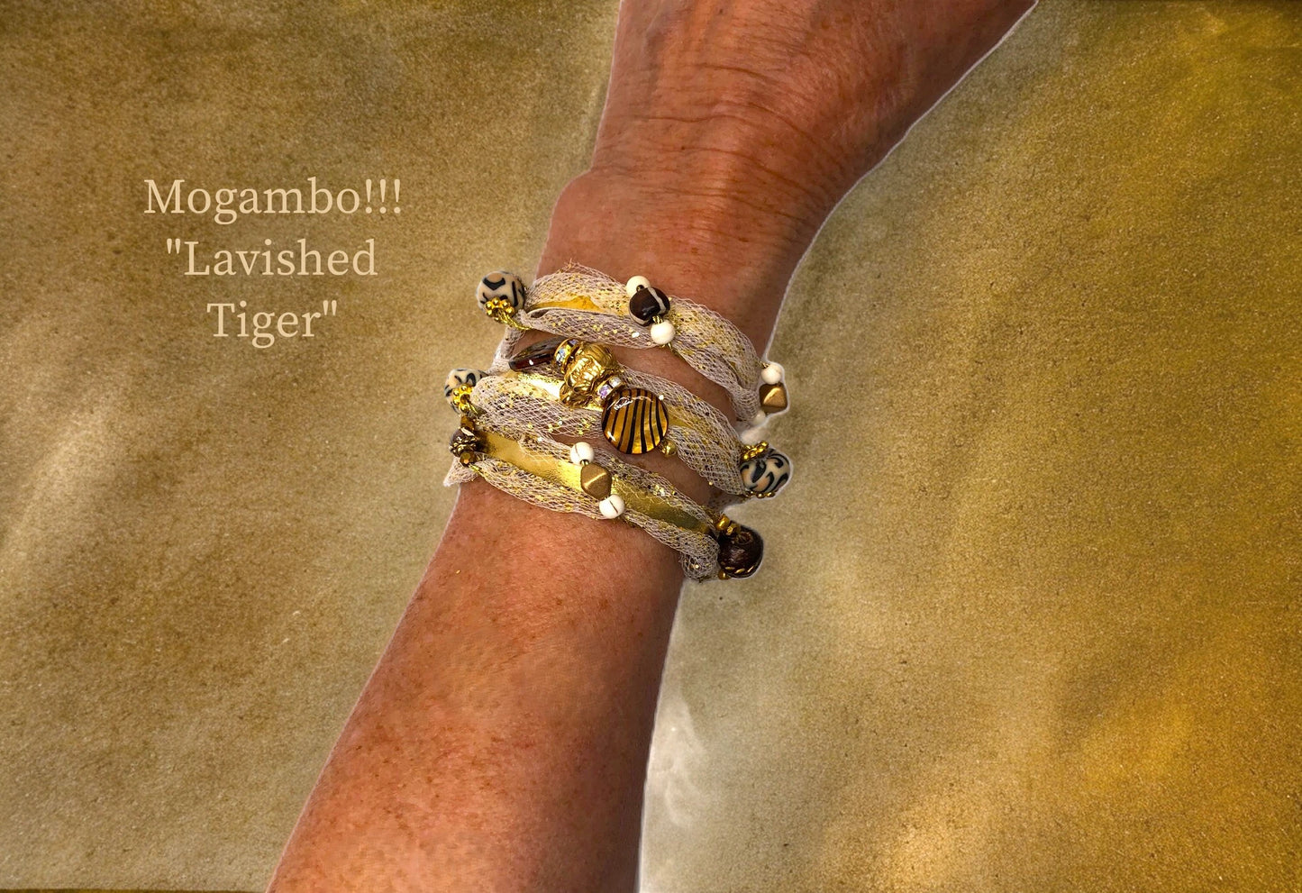 Mogambo!!! Upscale Tiger Gold African Themed bracelets for Evening and Cocktails. Beautiful Gold Triple Wrap w/ delicate Tulle, cascading African Beads, a Tiger Focal, and Magnet closure $41.99