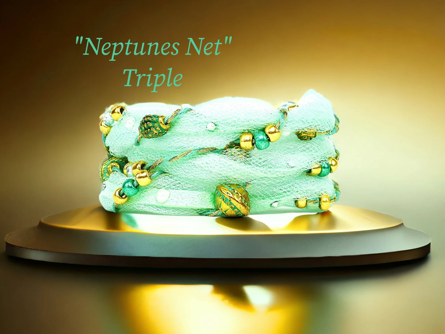 Neptune's Net Triple Wrap with Sea Foam faux suede, delicate matching Tulle, cascading gold thread, Brass treasure Patina beads, Tiny Austrian Crystals, Gold and Sea Foam Metallic Czech Beads. $48.99