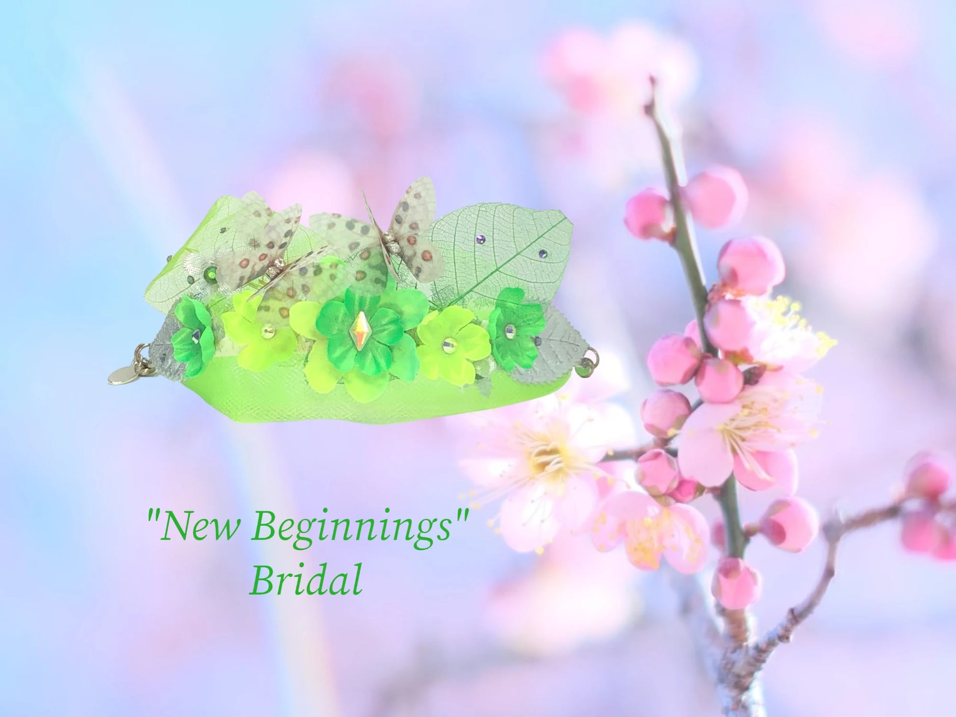 New Beginnings- Faux suede bracelet w/ magnetic closure. This bracelet has bright spring green silk flowers w/ matching Austrian Crystal centers & delicate tulle, bright green skeleton leaves w/ tiny crystal dew drops, metallic silver leaves, and 2 adorable silk butterflies w/ crystal centers. $42.99