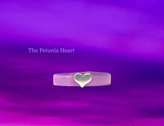 The Petunia Heart is simple and elegant with a touch of whimsey. Lilac Genuine Leather with a volupsuous Silver Heart Focal -magnet closure. $25