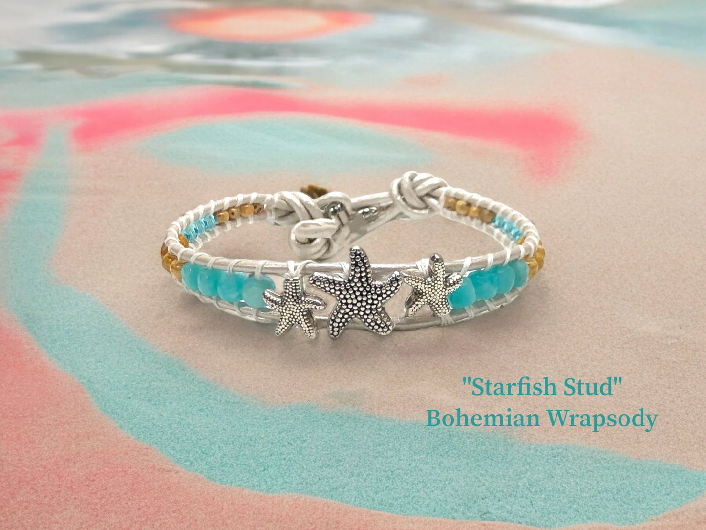 Bohemian Wrapsody w/ genuine white Pearlized leather encasing 3 Antique silver starfish, Amazonite, Austrian Turquoise Crystals and sand colored Czech beads, shell bead closure. $37.99