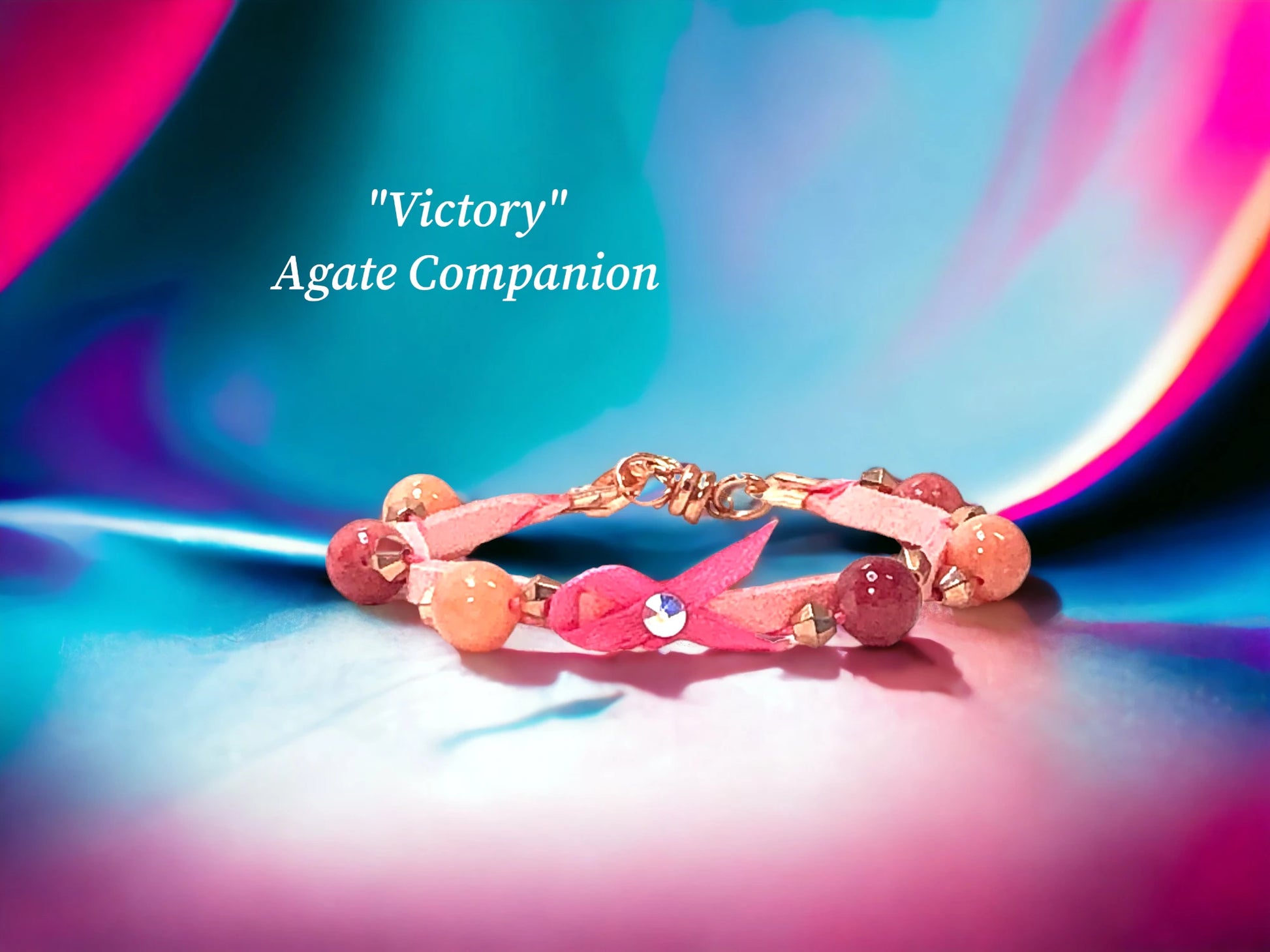 Victory single wrap with several shades of Pink Agate, Rose Gold Bi-cones and a Pink Victory Ribbon with Austrian Crystal Focal. $29