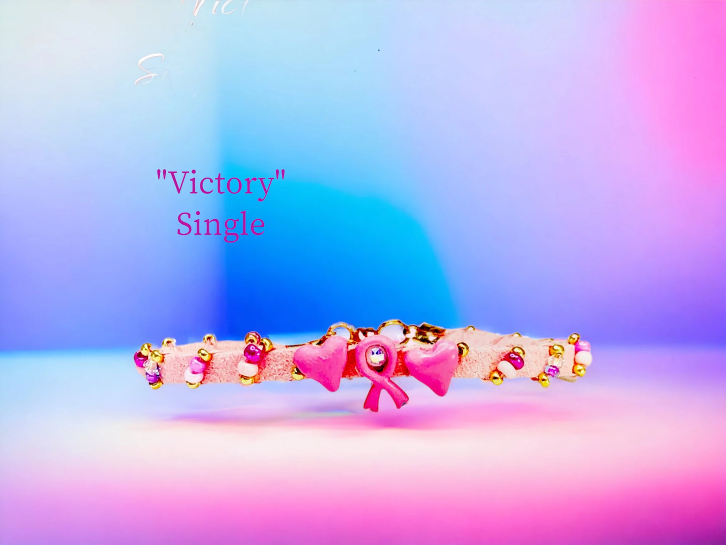 Victory Single wrap with Pink Ribbon and Hearts charm focal and a Austrian Crystal center, along with cascading Czech beads. $22.50