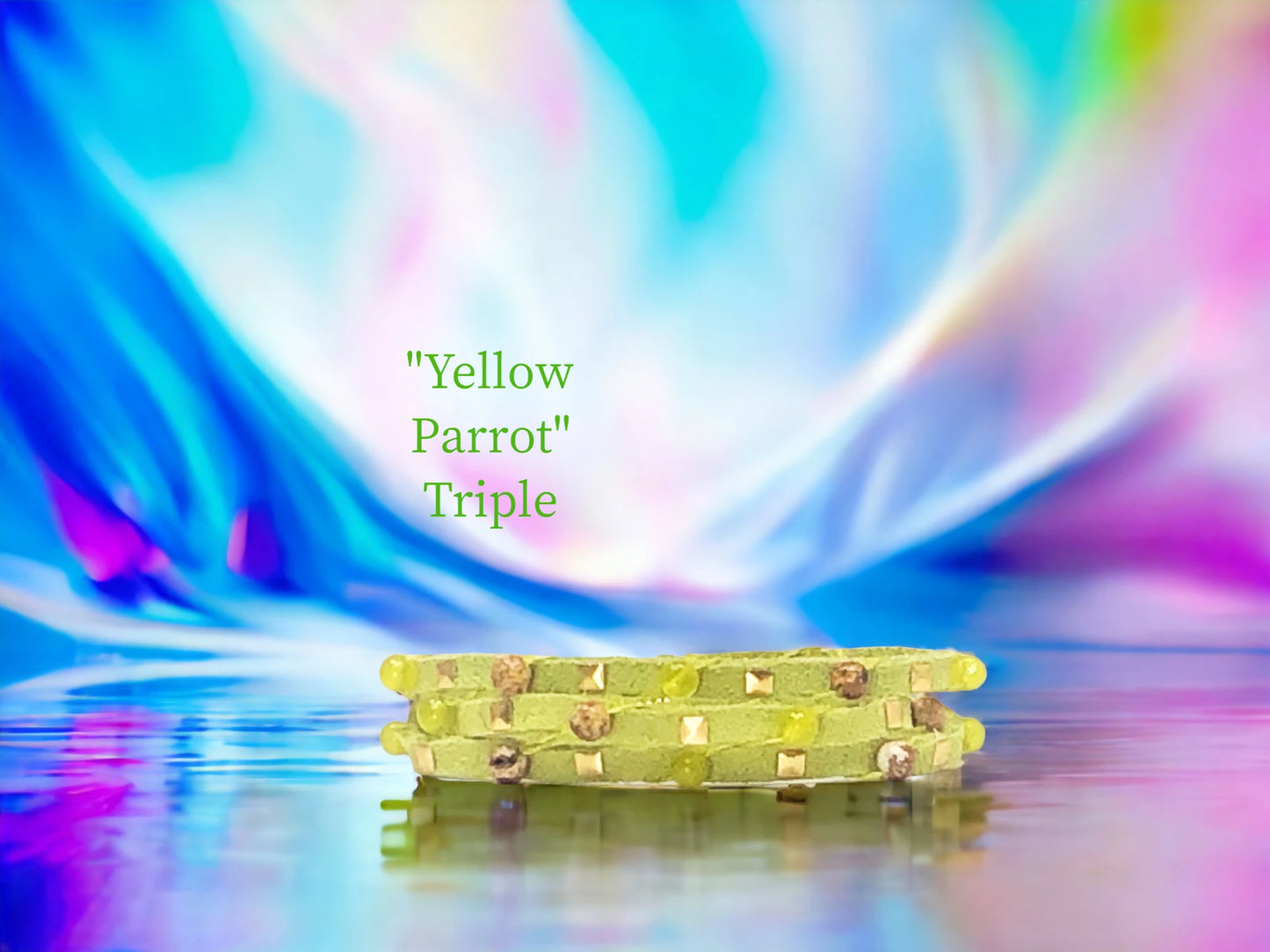 Yellow Parrot with gold Pyramid studs, with cascading Howlite and alternating Picture Agate. $26.99